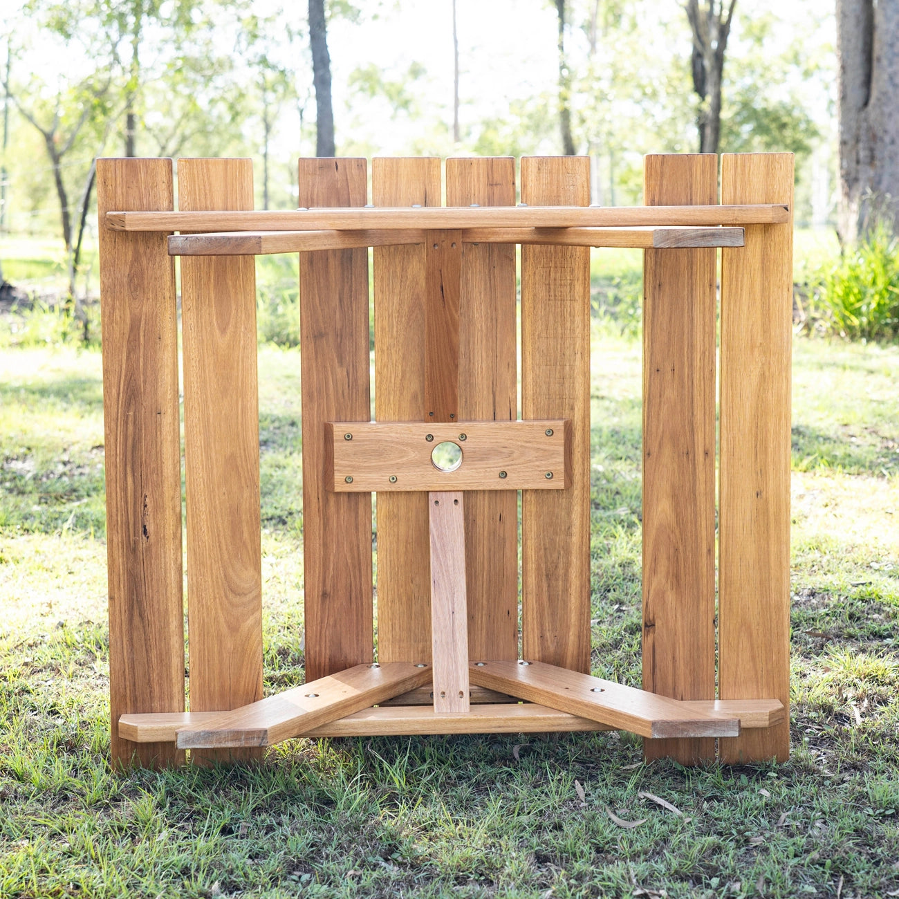 JJ Timber kids picnic table built from solid timber shown outdoors on grass.