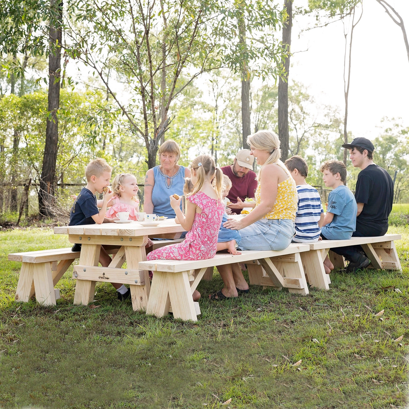 Children and parents enjoying breakfast together at JJ Timber kids picnic table.