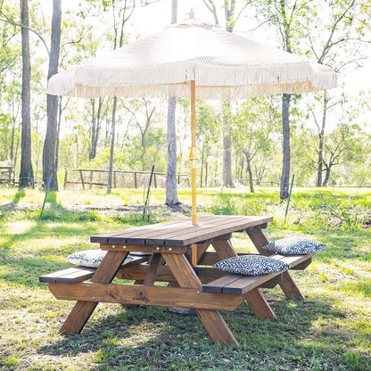JJ Timber heavy duty picnic table displayed in outdoor landscape with shade umbrella.