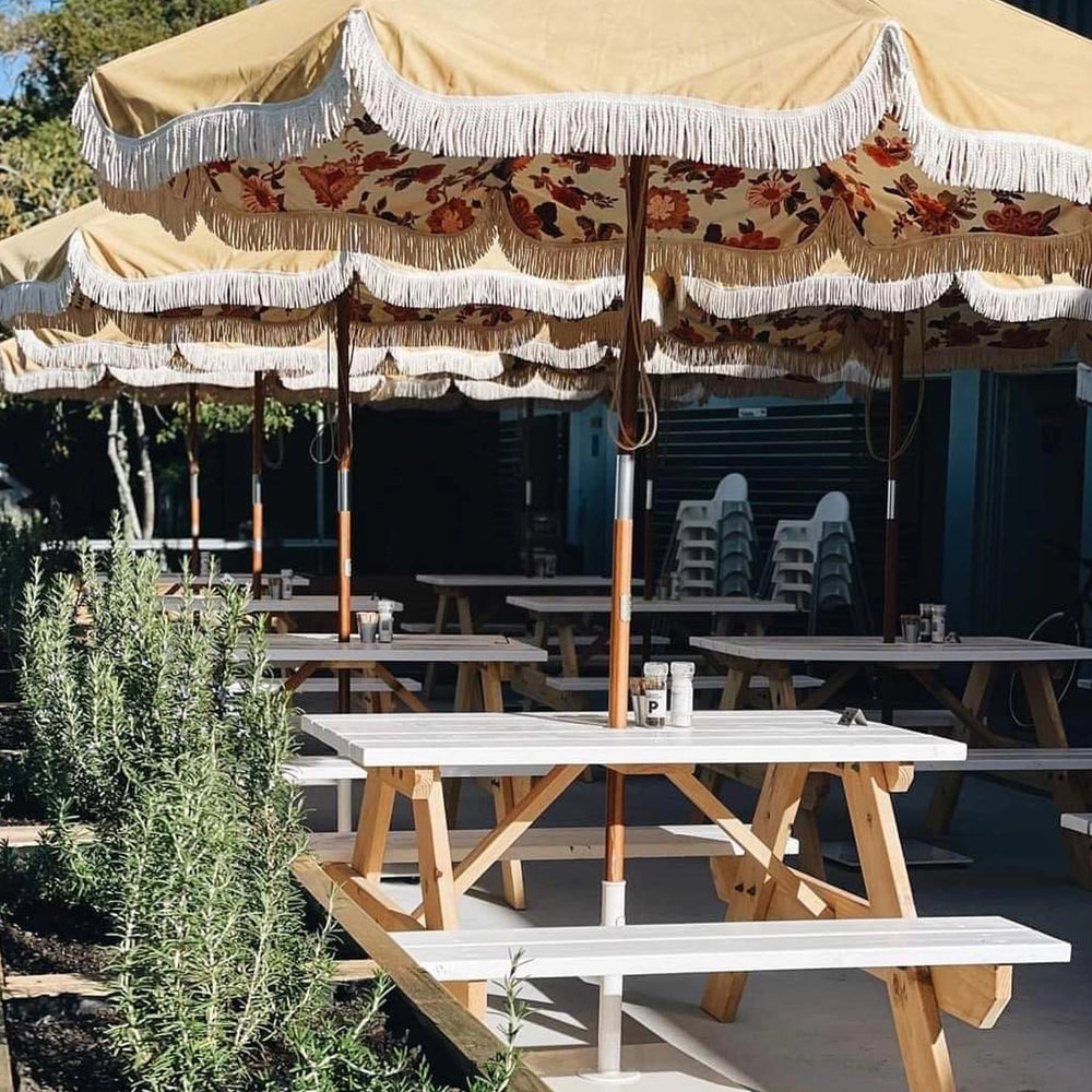 Outdoor café seating with JJ Timber Design picnic tables.