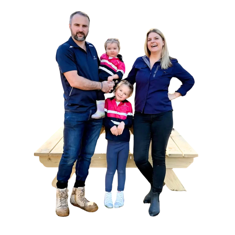 Family posing beside a JJ Timber Design timber stool.