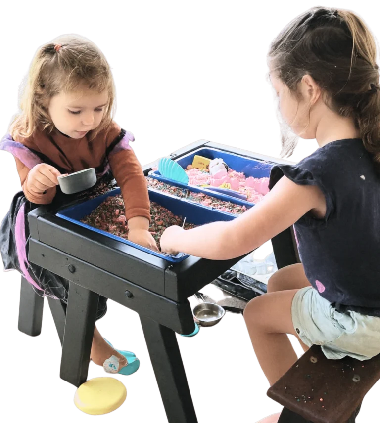 Two children using a JJ Timber Design sensory activity table.