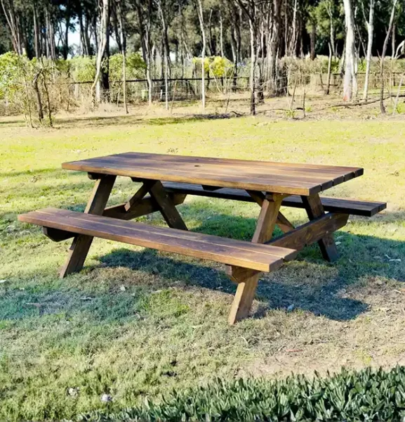 JJ Timber Design timber picnic table in a natural outdoor setting.