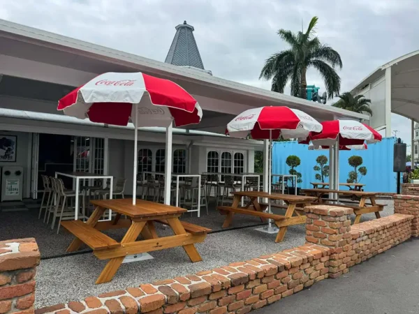 A custom timber picnic table placed in a paved outdoor dining environment