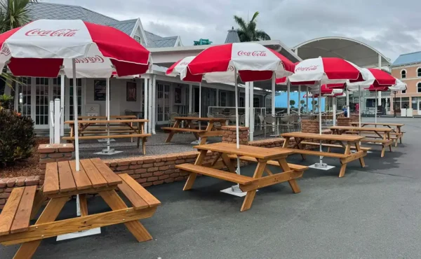 A custom timber picnic table installed in an outdoor commercial seating area