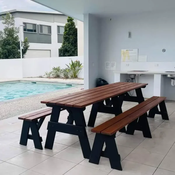 Kids outdoor picnic table by JJ Timber Design on artificial grass, sturdy timber seating designed for Queensland weather