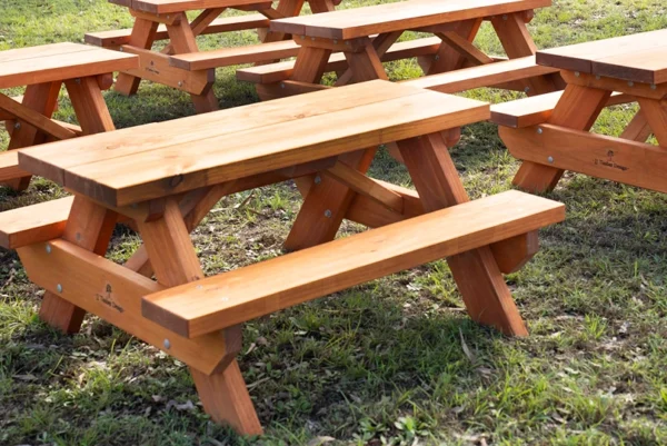 Angled view of JJ Timber Design premium wood kids picnic table showing sturdy outdoor kids seating